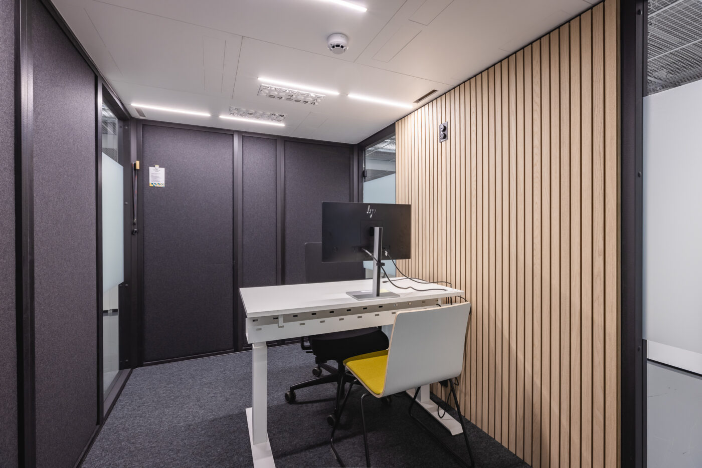 Interior of a sound-insulated workroom used for private customer service conversations