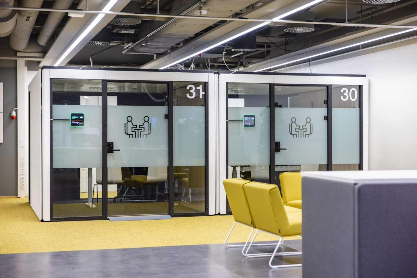 Two Octacell customer service workrooms side by side