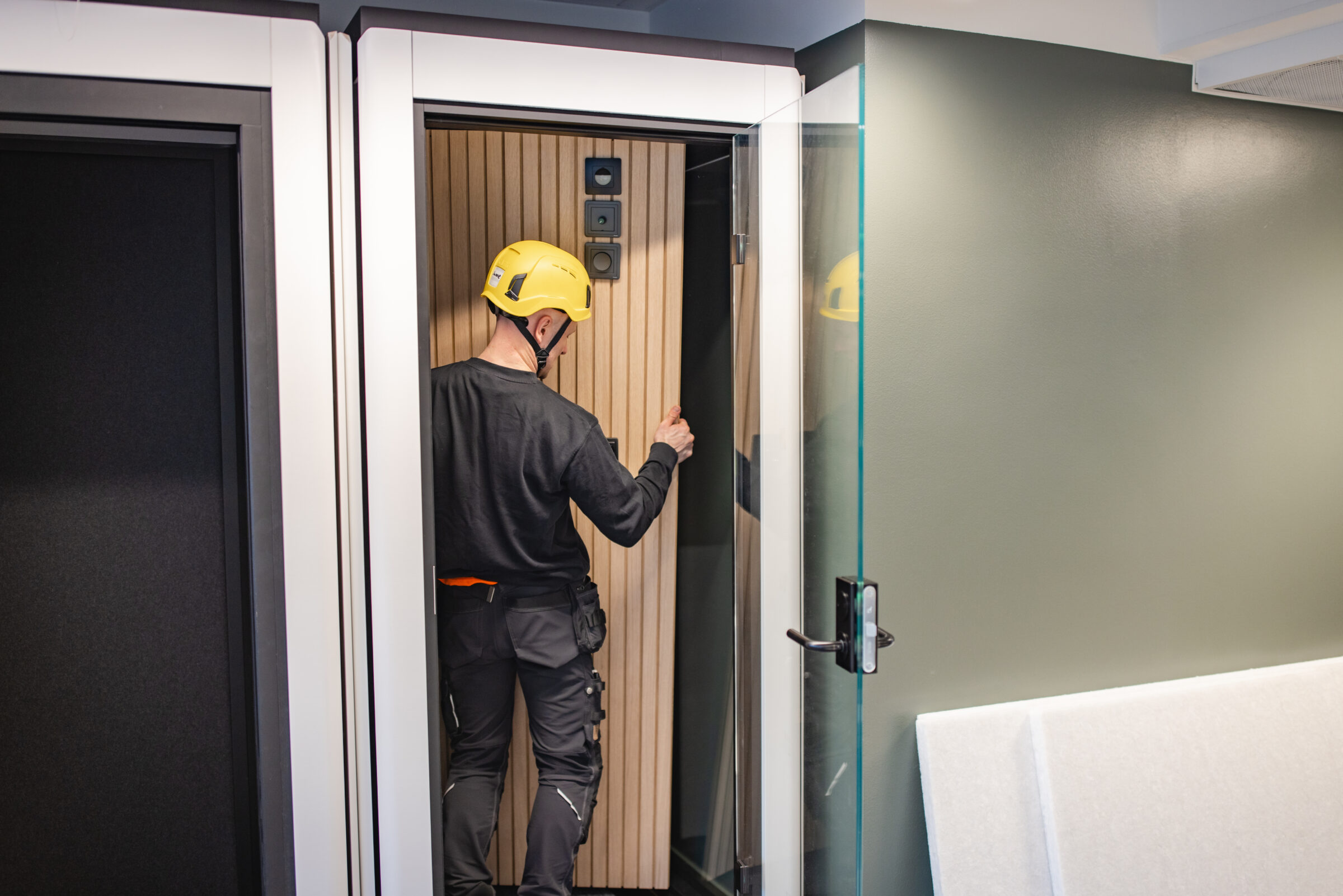 Person installing phone booth