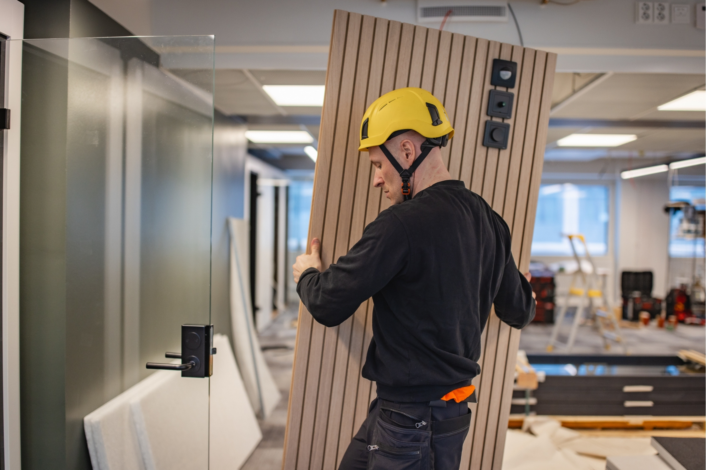 Installing a wood panel on an Octacell workroom